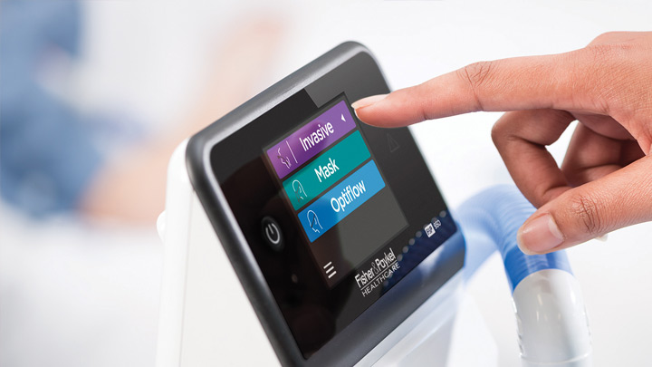 Close up of a hand operating the F&P 950 System touch screen