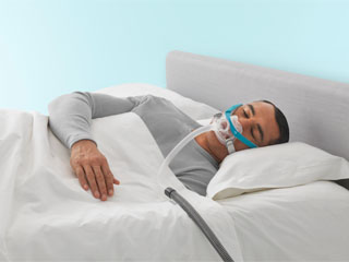 Man sleeping while wearing F&P Evora Full mask