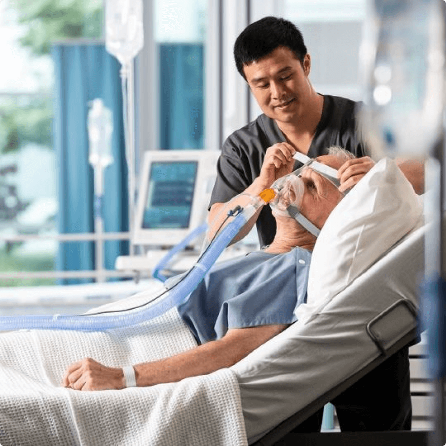 Medical staff helping patient to reduce chance of pressure ulcers forming