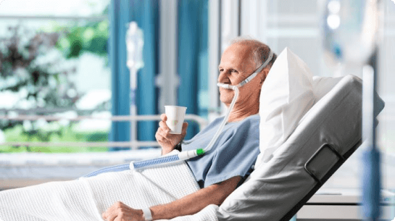 Patient sitting comfortably in hospital using Optiflow